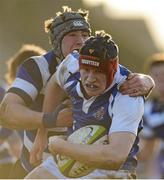 30 January 2013; Adam Horgan, Rockwell College, is tackled by Michael O'Donnell, Crescent CC. Munster Schools Senior Cup, Quarter-Final, Round 1, Rockwell v Crescent CC, Clanwilliam, Limerick. Picture credit: Diarmuid Greene / SPORTSFILE