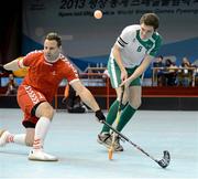 31 January 2013; Team Ireland's Joseph McCarthy, from Midleton, Co. Cork, in action against Thomas Praxamer, Austria. Division 2, Semi-Final, Austria v Ireland, 2013 Special Olympics World Winter Games, Floorball, Gangneung Indoor Sports Center, Gangneung, South Korea. Picture credit: Ray McManus / SPORTSFILE