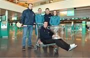 31 January 2013; Aer Lingus flight attendants Grainne Kelly, left, and Orla Kelly with Tipperary hurler Lar Corbett, left, CEO of Gaelic Players Association Dessie Farrell and Tyrone footballer Brian McGuigan, holding the Sam Maguire Cup prior to their departure to Breezy Point in New York today as part of a GPA work party where they will assist with the reconstruction of the local youth sports facilities destroyed during Hurricane Sandy. The party is travelling with the support of Aer Lingus. Dublin Airport, Dublin. Picture credit: Barry Cregg / SPORTSFILE