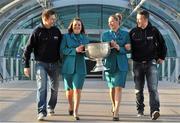 31 January 2013; Aer Lingus flight attendants Orla Kelly, left, and Grainne Kelly hold the Sam Maguire Cup with CEO of Gaelic Players Association Dessie Farrell, left, and Chairman of the Gaelic Players Association Dónal Óg Cusack prior to their departure to Breezy Point in New York today as part of a GPA work party where they will assist with the reconstruction of the local youth sports facilities destroyed during Hurricane Sandy. The party is travelling with the support of Aer Lingus. Dublin Airport, Dublin. Picture credit: Barry Cregg / SPORTSFILE