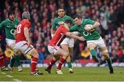 2 February 2013; Peter O'Mahony, Ireland, is tackled by Jamie Roberts, Wales. RBS Six Nations Rugby Championship, Wales v Ireland, Millennium Stadium, Cardiff, Wales. Picture credit: Brendan Moran / SPORTSFILE