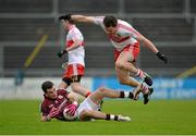3 February 2013; Johnny Duane, Galway, slides under James Kielt, Derry, to win the ball. Allianz Football League, Division 2, Galway v Derry, Pearse Stadium, Salthill, Galway. Picture credit: Barry Cregg / SPORTSFILE