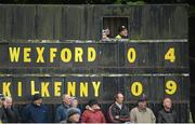 3 February 2013; Scoreboard attendants Michael Byrne, Connel Byrne and Andy Roche watch the action during the Wexford v Kilkenny match. Bórd na Móna Walsh Cup, Semi-Final, Wexford v Kilkenny, Blackwater, Co. Wexford. Picture credit: Matt Browne / SPORTSFILE