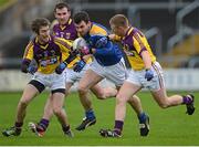 3 February 2013; Brendan McElvaney, Longford, in action against Redmond Barry, Craig Doyle and Aindreas Doyle, Wexford. Allianz Football League, Division 2, Wexford v Longford, Wexford Park, Wexford. Picture credit: Matt Browne / SPORTSFILE