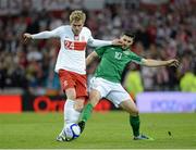 6 February 2013; Damien Perquis, Poland, in action against Shane Long, Republic of Ireland. International Friendly, Republic of Ireland v Poland, Aviva Stadium, Lansdowne Road, Dublin. Picture credit: Brian Lawless / SPORTSFILE