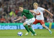 6 February 2013; James McCarthy, Republic of Ireland, in action against Daniel Lukasik, Poland. International Friendly, Republic of Ireland v Poland, Aviva Stadium, Lansdowne Road, Dublin. Picture credit: Brian Lawless / SPORTSFILE