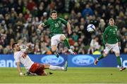 6 February 2013; Republic of Ireland's Wes Hoolahan shoots to score his side's second goal despite the attempts of Poland's Marcin Wasilewski. International Friendly, Republic of Ireland v Poland, Aviva Stadium, Lansdowne Road, Dublin. Picture credit: David Maher / SPORTSFILE