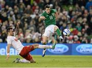6 February 2013; Republic of Ireland's Wes Hoolahan shoots to score his side's second goal despite the attempts of Poland's Marcin Wasilewski. International Friendly, Republic of Ireland v Poland, Aviva Stadium, Lansdowne Road, Dublin. Picture credit: David Maher / SPORTSFILE