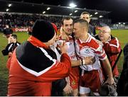 9 February 2013; Liam Watson, Loughgiel Shamrocks, is congratulted by team-mates and supporters after the game. AIB GAA Hurling All-Ireland Senior Club Championship Semi-Final, St Thomas, Galway v Loughgiel Shamrocks, Antrim, Parnell Park, Donnycarney, Dublin. Picture credit: Dáire Brennan / SPORTSFILE