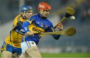 9 February 2013; Shane Bourke, Tipperary, in action against James McInerney, Clare. Waterford Crystal Cup Final, Tipperary v Clare, Semple Stadium, Thurles, Co. Tipperary. Picture credit: Barry Cregg / SPORTSFILE