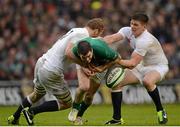 10 February 2013; Jonathan Sexton, Ireland, is tackled by Chris Robshaw, left and Owen Farrell, England. RBS Six Nations Rugby Championship, Ireland v England, Aviva Stadium, Lansdowne Road, Dublin. Picture credit: Stephen McCarthy / SPORTSFILE