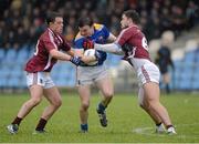 10 February 2013; Donal McElligott, Longford, in action against Ronan Foley and James Dolan, Westmeath. Allianz Football League, Division 2, Longford v Westmeath, Pearse Park, Longford. Picture credit: Oliver McVeigh / SPORTSFILE