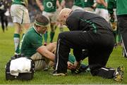 10 February 2013; Brian O'Driscoll, Ireland, with team doctor Eanna Falvey after recieving an injury. RBS Six Nations Rugby Championship, Ireland v England, Aviva Stadium, Lansdowne Road, Dublin. Picture credit: Brendan Moran / SPORTSFILE