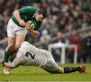10 February 2013; Jonathan Sexton, Ireland, is tackled by Tom Youngs, England. RBS Six Nations Rugby Championship, Ireland v England, Aviva Stadium, Lansdowne Road, Dublin. Picture credit: David Maher / SPORTSFILE