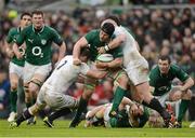 10 February 2013; Sean O'Brien, Ireland, is tackled by Joe Marler, left and Dan Cole, England. RBS Six Nations Rugby Championship, Ireland v England, Aviva Stadium, Lansdowne Road, Dublin. Picture credit: David Maher / SPORTSFILE