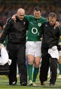 10 February 2013; Ireland's Jonathan Sexton is helped from the pitch by team doctor Dr. Eanna Falvey, left, and team physio Dr. James Allen. RBS Six Nations Rugby Championship, Ireland v England, Aviva Stadium, Lansdowne Road, Dublin. Picture credit: Brendan Moran / SPORTSFILE