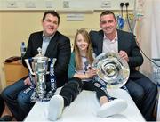 11 February 2013; The RBS 6 Nations and Triple Crown Trophies visited Our Lady's Hospital for Sick Children, Crumlin, Dublin, today, as part of the Ulster Bank and RBS 6 Nations Trophy Tour, which is travelling across the country this week. Pictured at Our Lady's Hospital for Sick Children, with the Six Nations  and Triple Crown trophies, is Ciara Sherry, age 11, from Scotstown, Co. Monaghan, with former Ireland internationals Reggie Corrigan, left, and Alan Quinlan. The trophy tour is being held as part of Ulster Bank’s sponsorship of community rugby in Ireland which includes the Ulster Bank League and Ulster Bank RugbyForce. Now in its third year, the RugbyForce initiative provides rugby clubs with the opportunity to win support packages to renovate their club and upgrade their facilities. This year, five clubs will receive a €5,000 prize, with one coming down to a public vote. Rugby clubs have until Friday April 12th to enter RugbyForce on Ulster Bank’s dedicated rugby website, www.ulsterbank.com/rugby. Ulster Bank and RBS 6 Nations Trophy Tour, Our Lady's Hospital for Sick Children, Crumlin, Dublin. Picture credit: Barry Cregg / SPORTSFILE