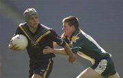 16 April 2003; Kyle Archibald, Australia, is tackled by Ireland's Brian Faherty . U-17 International Rules Series, 2nd Test, Ireland v Australia, Croke Park, Dublin. Picture credit; Pat Murphy / SPORTSFILE *EDI*