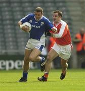 20 April 2003; Darren Rooney, Laois, in action against Armagh's Barry O'Hagan. Allianz National Football League,  Division 1, Armagh v Laois, Croke Park, Dublin. Football. Picture credit; Ray McManus / SPORTSFILE *EDI*