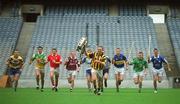 28 April 2003; Kilkenny captain Charlie Carter, with the Liam MacCarthy Cup, is chased by captains from participating counties, from left, Sean McMahon, Clare, Gary Hanniffy, Offaly, Alan Browne, Cork, Ollie Canning, Galway, Tony Browne, Waterford, Kevin Flynn, Dublin, Brian O'Meara, Tipperary, Mark Foley, Limerick and Paul Cuddy Laois, at the launch of the Guinness All-Ireland Senior Hurling Championship 2003 at Croke Park, Dublin. Picture credit; Brendan Moran / SPORTSFILE