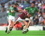 4 May 2003; Martin Flanagan, Westmeath, is tackled by Limerick's Brian Begley, left, and John Galvin. Allianz National Football League Division 2 Final, Westmeath v Limerick, Croke Park, Dublin. Football. Picture credit; Ray McManus / SPORTSFILE