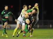 15 February 2013; Kyle Tonetti, Connacht, is tackled by Jonathan Spratt, left, and Joe Bearman, Ospreys. Celtic League 2012/13, Round 15, Connacht v Ospreys, Sportsground, Galway. Picture credit: Tommy Grealy / SPORTSFILE