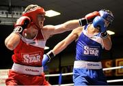 16 February 2013; Kenneth Egan, Neilstown, right, exchanges punches with Davey Joe Joyce, Crumlin, in their 81kg bout. National Elite Boxing Championships, Semi-Finals, National Stadium, Dublin. Picture credit: Pat Murphy / SPORTSFILE