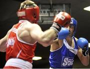 16 February 2013; Kenneth Egan, Neilstown, right, exchanges punches with Davey Joe Joyce, Crumlin, in their 81kg bout. National Elite Boxing Championships, Semi-Finals, National Stadium, Dublin. Picture credit: Pat Murphy / SPORTSFILE