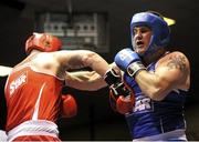 16 February 2013; Michael McKeever, St. Matthews, right, exchanges punches with Niall Kennedy, Gorey, during their 91+kg bout. National Elite Boxing Championships, Semi-Finals, National Stadium, Dublin. Picture credit: Pat Murphy / SPORTSFILE