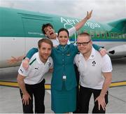 22 February 2013; Ireland rugby players Donncha O'Callaghan, behind, Luke Fitzgerald and Tom Court, right, with Aer Lingus Regional air hostess Aoife Quigley, at Dublin airport as the squad depart for their RBS Six Nations Rugby Championship match against Scotland, in Edinburgh, on Sunday. Ireland Rugby Squad Depart for Edinburgh, Dublin Airport, Dublin. Picture credit: Matt Browne / SPORTSFILE