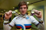 22 February 2013; Ireland's Martyn Irvine with his gold and silver medals in Dublin airport on his return from the UCI Track Cycling World Championships in Minsk, Belarus. Irvine won gold in 15km scratch race and silver in 4km individual pursuit. Dublin Airport, Dublin. Photo by Sportsfile