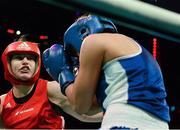 24 February 2013; Katie Taylor, Ireland, exchanges punches with Maike Klüners, during their International bout. Katie Taylor Fight Night, Bord Gais Energy Theatre, Grand Canal Square, Docklands, Dublin. Picture credit: David Maher / SPORTSFILE
