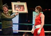 24 February 2013; Katie Taylor, Ireland, views a painting by Artist Michael Hanrahan which depicts her in action against Maike Klüners, during their international bout. Katie Taylor Fight Night, Bord Gais Energy Theatre, Grand Canal Square, Docklands, Dublin. Picture credit: David Maher / SPORTSFILE