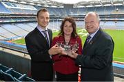 28 February 2013; The 2012 TESCO HomeGrown Club Person of the Year Awards took place today at Croke Park. The awards recognise the dedication and enthusiasm of our volunteers to their clubs throughout the country. Pictured receiving her award is Catherine Ring, from Knocknagree Ladies GFC, Co. Cork, with Patrick O'Connor, Local Marketing Manager Tesco, left, and Pat Quill, President of the Ladies Football Association. Croke Park, Dublin. Picture credit: Barry Cregg / SPORTSFILE