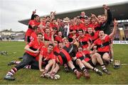 2 March 2013; University College Cork players celebrate with team mentor Jim Roche and the Fitzgibbon Cup after the game. Irish Daily Mail Fitzgibbon Cup Final, Mary Immaculate College, Limerick v University College Cork, Pearse Stadium, Galway. Picture credit: Barry Cregg / SPORTSFILE