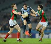 2 March 2013; Bernard Brogan, Dublin, is tackled by Mayo defenders Donal Vaughan, left, and Ger Cafferkey. Allianz Football League, Division 1, Dublin v Mayo, Croke Park, Dublin. Picture credit: Ray McManus / SPORTSFILE