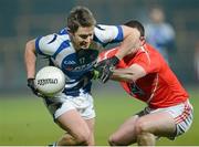 2 March 2013; Michael John Tierney, Laois, in action against Gerard Hoey, Louth. Allianz Football League, Division 2, Laois v Louth, O'Moore Park, Portlaoise, Co. Laois. Picture credit: Matt Browne / SPORTSFILE