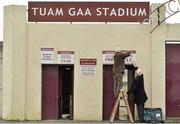 3 March 2013; Ground officials Tom Reilly, left, and Seamus Connolly, both from Tuam, Co. Galway, put up siganage at the turnstiles ahead of the game. Allianz Football League, Division 2, Galway v Westmeath, Tuam Stadium, Tuam, Co. Galway. Picture credit: Barry Cregg / SPORTSFILE