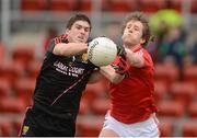 3 March 2013; Connaire Harrison, Down, in action against Eoin O'Mahony, Cork. Allianz Football League, Division 1, Down v Cork, Pairc Esler, Newry, Co. Down. Photo by Sportsfile