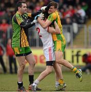 3 March 2013; Matthew Donnelly, Tyrone, in dispute with Paul Durcan and Eamonn McGee, Donegal. Allianz Football League, Division 1, Tyrone v Donegal, Healy Park, Omagh, Co. Tyrone. Picture credit: Oliver McVeigh / SPORTSFILE