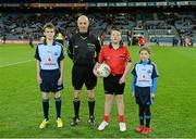 2 March 2013; Match referee Cormac Reilly with Mark Cleary, aged 12, left, from Raheny GAA, Jack Roche, aged 11, Trinity Gaels, and Caoimhe Keohane, aged nine, Scoil Uí Chonaill, before the game. Allianz Football League, Division 1, Dublin v Mayo, Croke Park, Dublin. Picture credit: Ray McManus / SPORTSFILE
