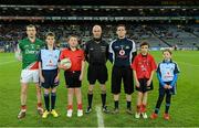 2 March 2013; Mayo captain Keith Higgins, match referee Cormac Reilly and Dublin captain Stephen Cluxton with Mark Cleary, aged 12, left, Raheny GAA, Jack Roche, aged 11, Trinity Gaels, Scott Foy, aged 12, Naomh Barróg, and Caoimhe Keohane, aged nine, Scoil Uí Chonaill, before the game. Allianz Football League, Division 1, Dublin v Mayo, Croke Park, Dublin. Picture credit: Ray McManus / SPORTSFILE