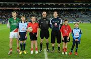 2 March 2013; Mayo captain Keith Higgins, match referee Cormac Reilly and Dublin captain Stephen Cluxton with Mark Cleary, aged 12, left, Raheny GAA, Jack Roche, aged 11, Trinity Gaels, Scott Foy, aged 12, Naomh Barróg, and Caoimhe Keohane, aged nine, Scoil Uí Chonaill, before the game. Allianz Football League, Division 1, Dublin v Mayo, Croke Park, Dublin. Picture credit: Ray McManus / SPORTSFILE