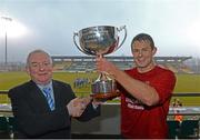 6 March 2013; IT Carlow captain Jamie Carr is presented with the cup by FAI President Paddy McCaul. CFAI UMBRO Cup Final. IT Carlow v Waterford IT. Tallaght Stadium, Talllaght, Dublin. Picture credit: David Maher / SPORTSFILE