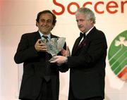 27 April 2003; Former French International Michel Platini is presented with the International Personality Award by FAI President Milo Corcoran at the eircom / Football Association of Ireland Awards at the Citywest Hotel, Dublin. Soccer. Picture credit; Brendan Moran / SPORTSFILE *EDI*