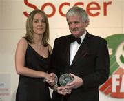 27 April 2003; Yvonne Treacy, Arsenal, is presented with the Ladies Player of the Year Award by FAI President Milo Corcoran at the eircom / Football Association of Ireland Awards at the Citywest Hotel, Dublin. Soccer. Picture credit; Brendan Moran / SPORTSFILE *EDI*