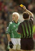 11 May 2003; Limerick's Diarmuid Sheehy is shown a yellow card by referee Brian White. Bank of Ireland Munster Senior Football Championship, Cork v Limerick, Pairc Ui Chaoimh, Cork. Picture credit; Brendan Moran / SPORTSFILE *EDI*