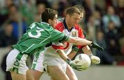 11 May 2003; Kevin O'Dwyer, Cork, in action against Limerick's Conor Fitzgerald (13) and Brian Begley. Bank of Ireland Munster Senior Football Championship, Cork v Limerick, Pairc Ui Chaoimh, Cork. Picture credit; Brendan Moran / SPORTSFILE *EDI*