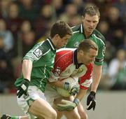 11 May 2003; Kevin O'Dwyer, Cork, in action against Limerick's Conor Fitzgerald, left, and Brian Begley. Bank of Ireland Munster Senior Football Championship, Cork v Limerick, Pairc Ui Chaoimh, Cork. Picture credit; Brendan Moran / SPORTSFILE *EDI*