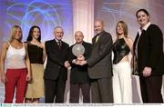 2 May 2003; Mark Ingle, Mercy Coolock, is presented with the Women's Division One Club of the Year by Dermot Byrne, Commercial manager, ESB , 3rd from left, and Tony Colgan, President of the IBA, 3rd from right, at the Irish Basketball Annual Awards at the Burlington Hotel, Dublin. Also in picture are, from left, Pamela Grogan, Vicki Ronning, Sarah Hughes, and Eleanor Curran. Picture credit; Brendan Moran / SPORTSFILE *EDI*